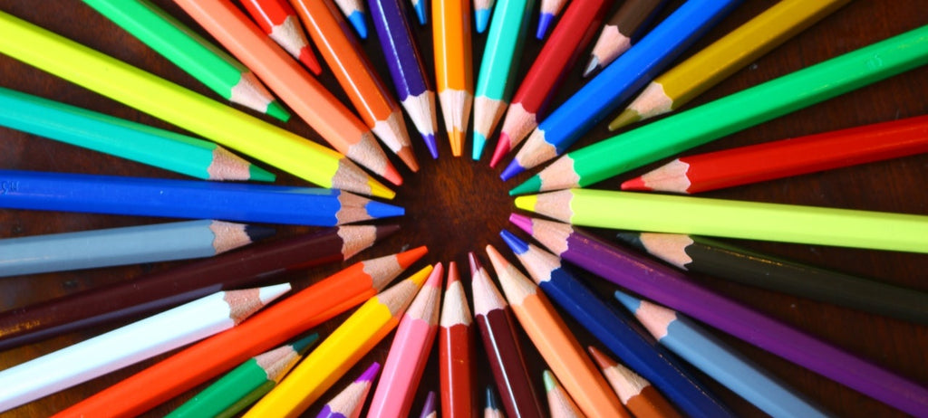 Colored pencils arranged in a ring.