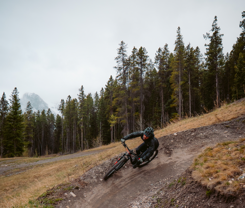 Endurance athlete mountain biking in Canmore Alberta Canada fuelled by vegan food products