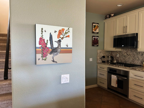 Photo of Roadrunner piece hanging in the collector's kitchen entryway