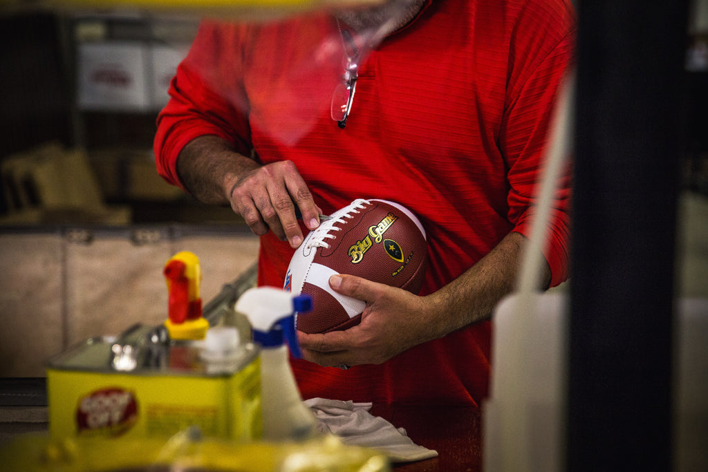 After the laces are in place, the footballs are fully inflated