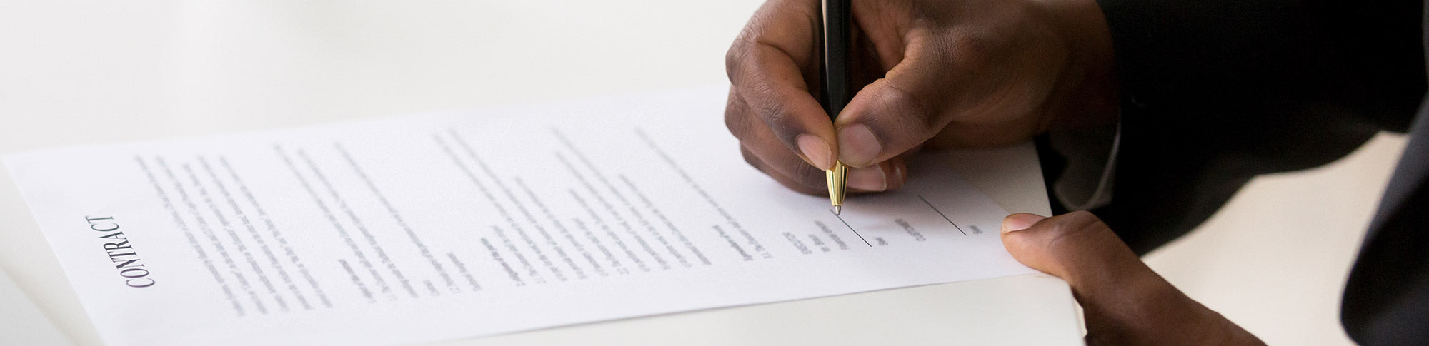 Man signing a copier lease agreement