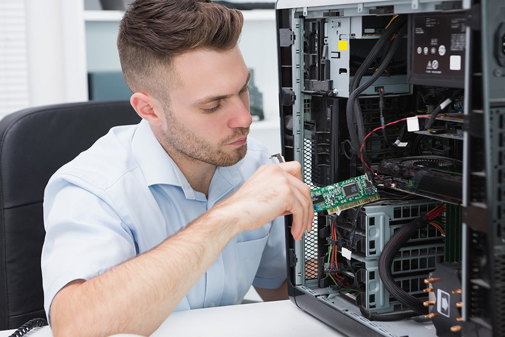 Man repairing a computer