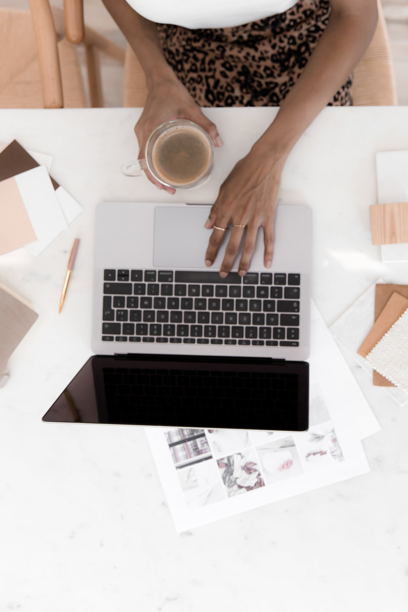 Woman working on her laptop with a cup of coffee