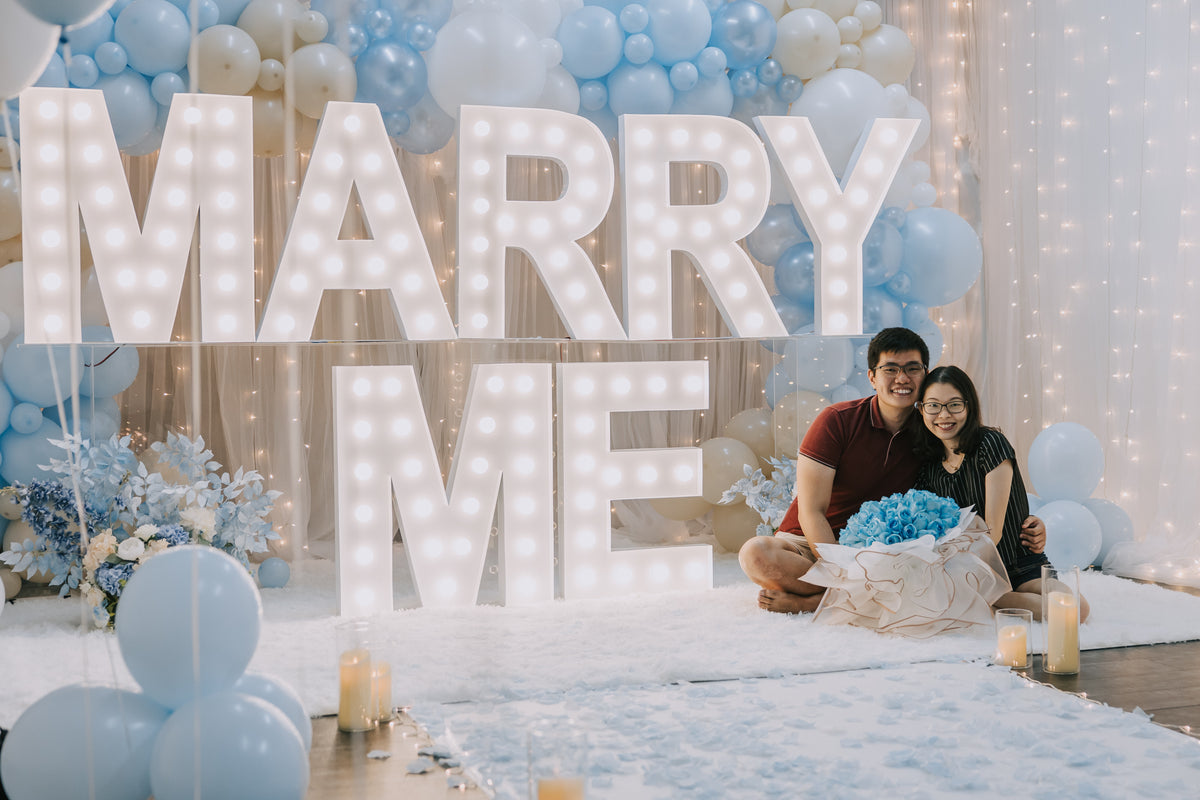 Romantic Proposal in Singapore with MARRY ME Marquee Lights and Organic Balloon Garland at Haus of Feel's Indoor Studio by Style It Simply