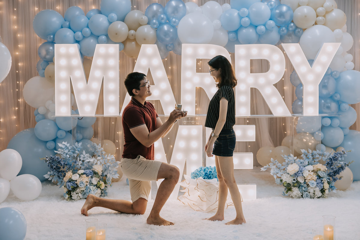 Romantic Proposal in Singapore with MARRY ME Marquee Lights and Organic Balloon Garland at Haus of Feel's Indoor Studio by Style It Simply