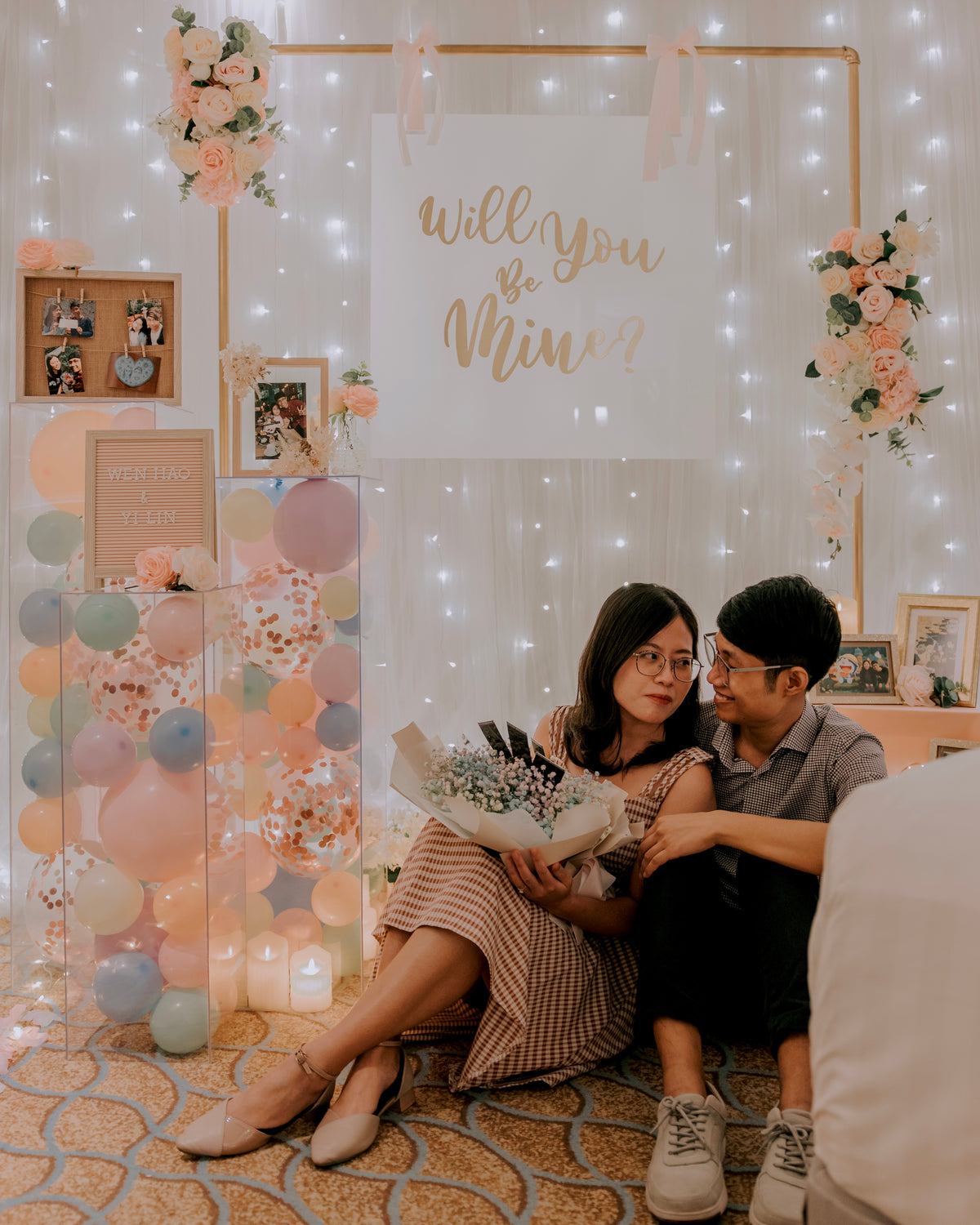 Romantic Hotel Room Proposal in Singapore with Fairylight Backdrop, Pastel Balloons and Flowers by Style It Simply
