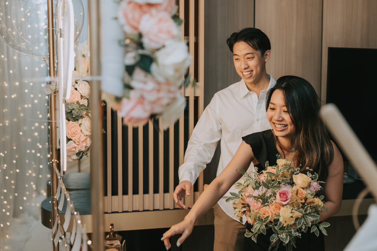Romantic Hotel Room Proposal Decor in ParkRoyal Collection Marina Bay Singapore with Fairylight Backdrop, Pastel Balloons and Flowers by Style It Simply