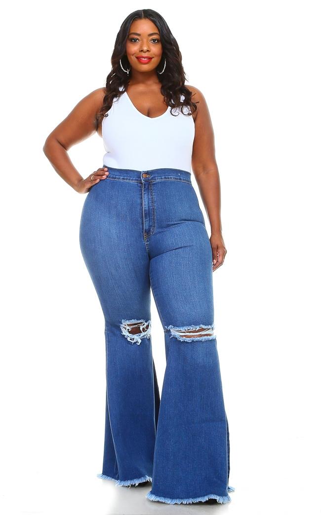 Plus Size Vibrant Ripped Knee Super Flare Jeans - Medium Denim | SohoGirl.com