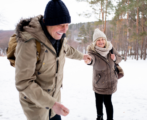 Elderly couple walking in the snow