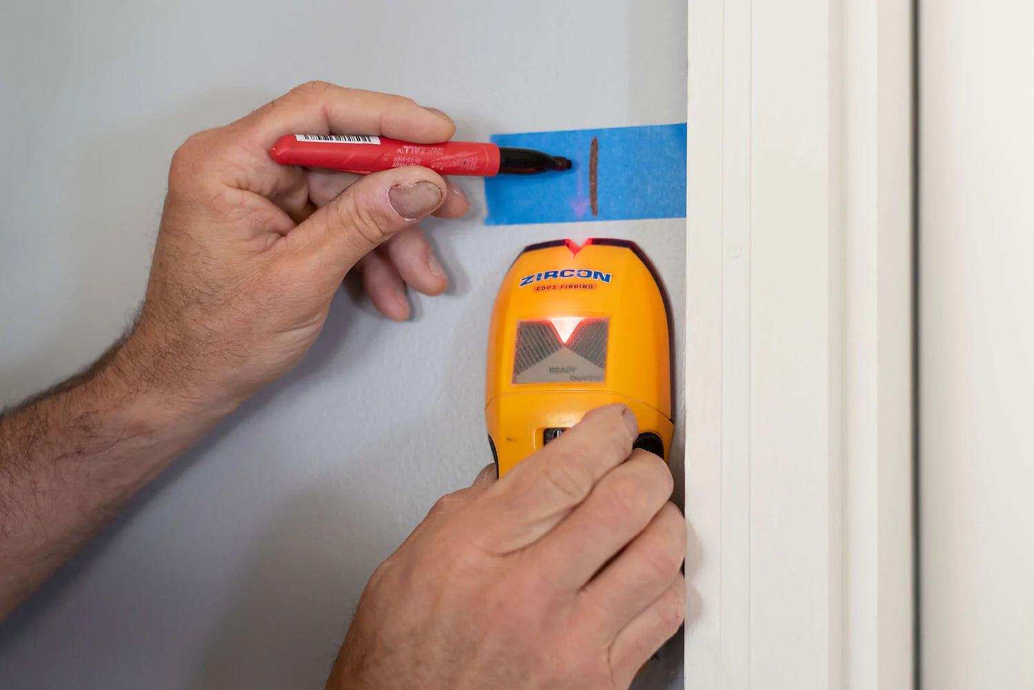 Marking wall with stud finder