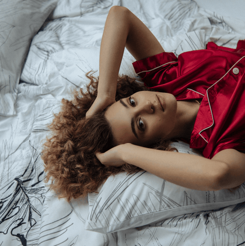 girl lying on her bed comfortably