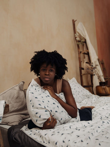 girl lying on her bed comfortably