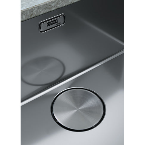 A close view of the Franke Mythos MYX Stainless Steel Sink's drain.