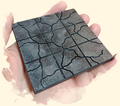 image of a 3x3 dungeon tile painted in a stony effect with mottled grey colors and the 1 inch grid in darker black to stand out