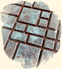 Close up of dungeon tiles with darker grey and brown paint added over the original layer. Terrain looks darker and patchy, like the stone is flawed. 
