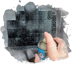 Me priming terrain black, standing it up against some card. Not a very interesting picture to be honest but it is instructive