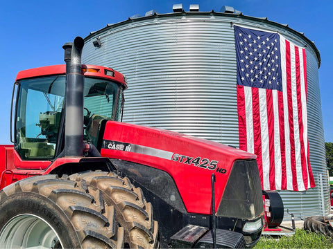 Large American flag on grain bin at Tice Family Farms