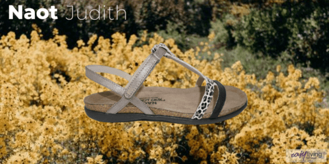 leopard print sandal in white grey and black sitting on a bed of yellow flowers