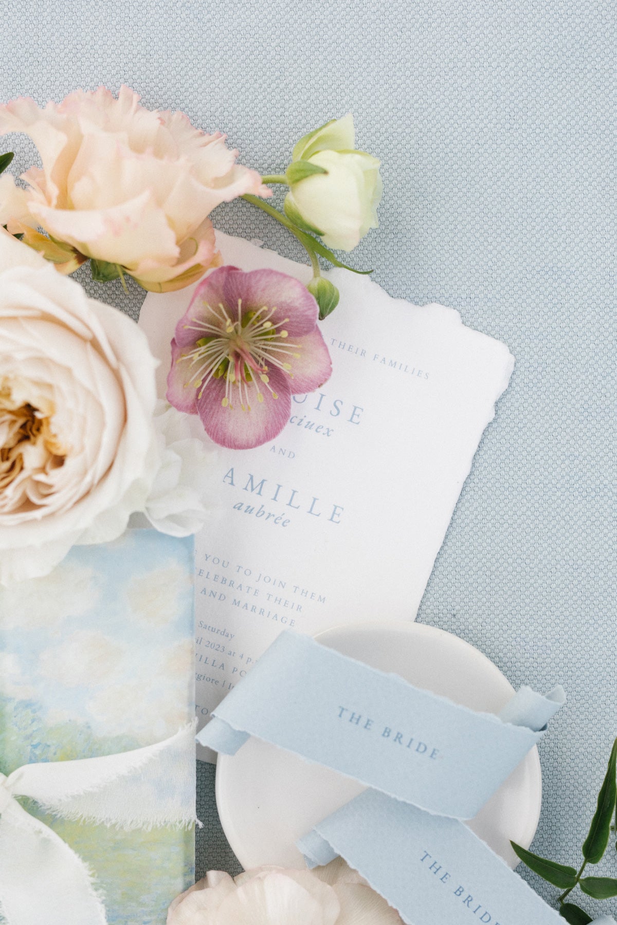 A stunning wedding invitation design featuring intricate details on handmade paper
