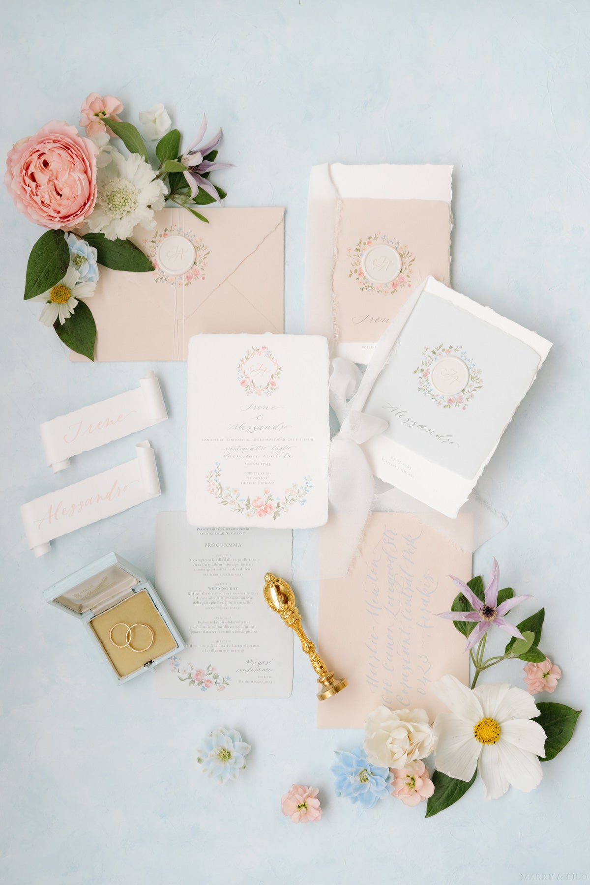 Exquisite wedding invitation suite on textured handmade paper, a testament to timeless elegance