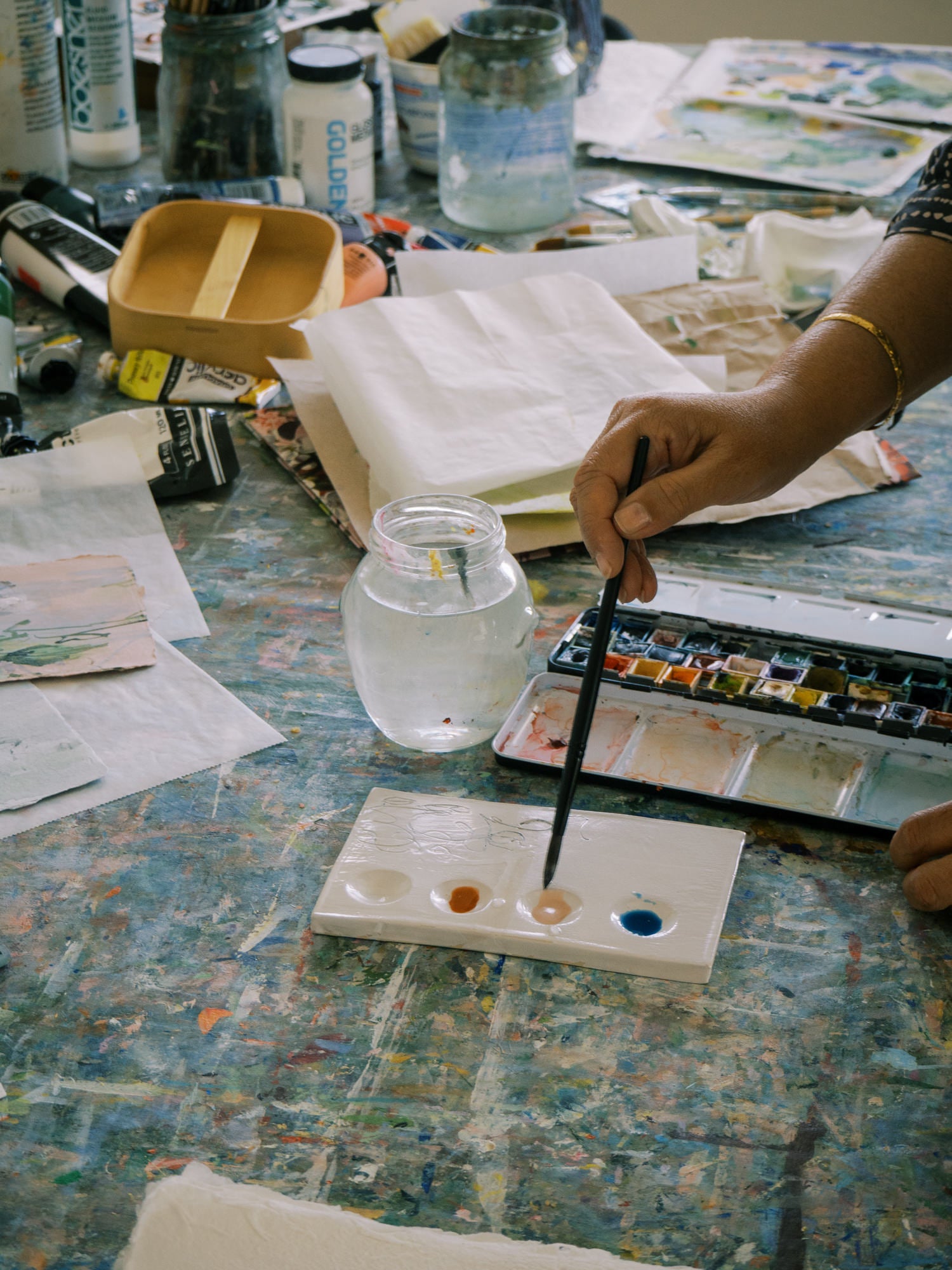 Witness the magic of Sonal Nathwani's artistry, where each stroke breathes life into handmade paper.