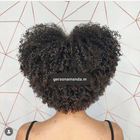 curly natural hair cut into a heart afro
