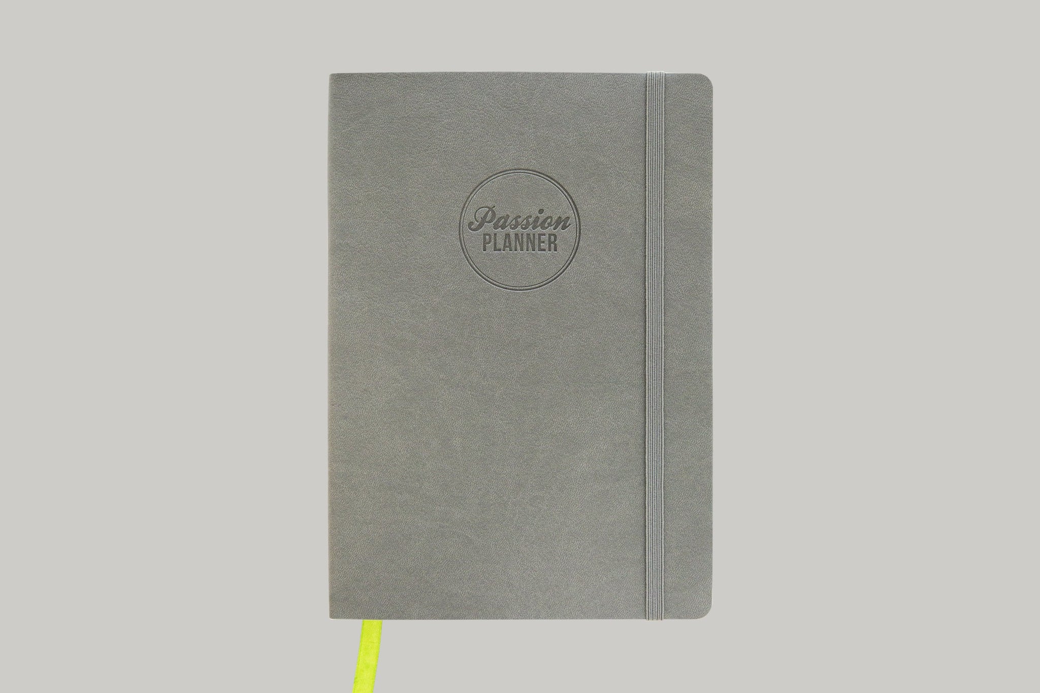 Gray Passion Planner with Lime Green Ribbon Against Light Gray Background