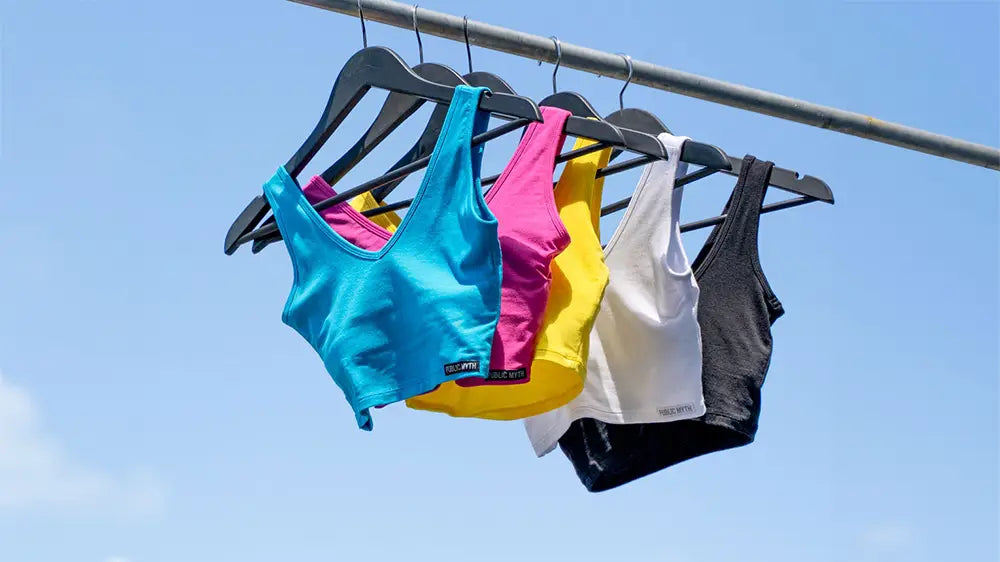 Sports Bra hanging on hangers in the sunshine