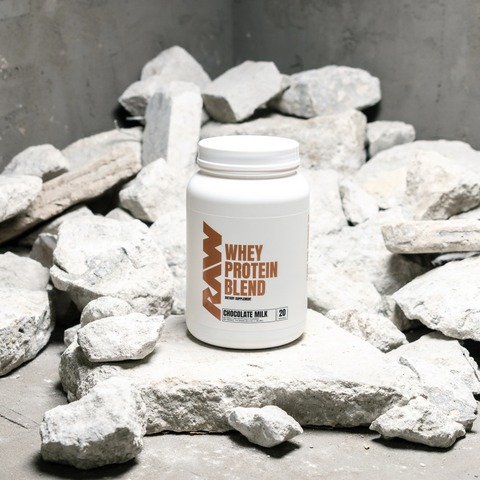 A white and brown tub of RAW’S Whey Protein Blend