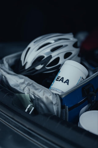 A bike helmet, and a tub of EAA from RAW Nutrition