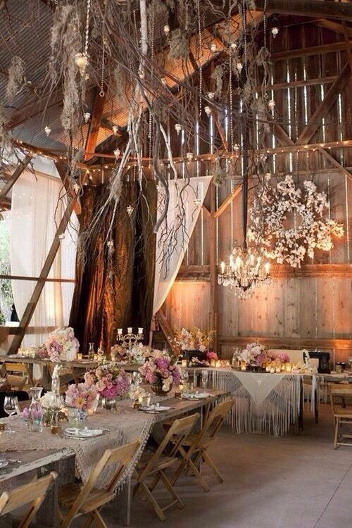 Rustic Table Decor with Wine Bottles, Roses, and Hydrangeas at The  Enchanted Barn