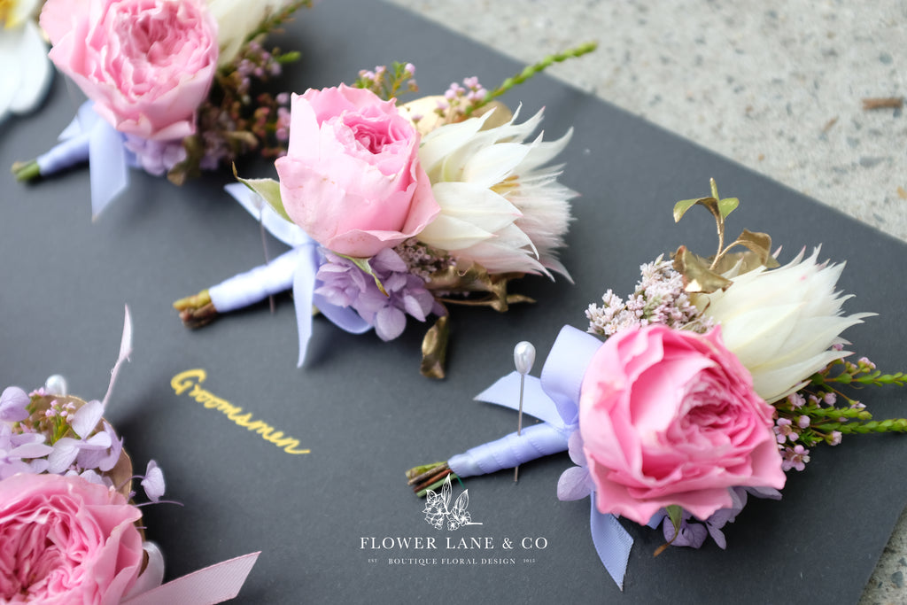 wedding-qvb-tearoom-pink-purple-romantic-buttonhole-groom