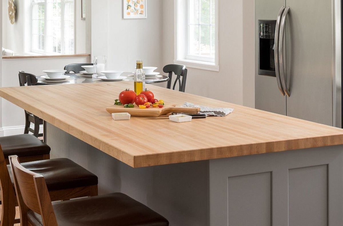 elliptical c-table kitchen island with butcher block top