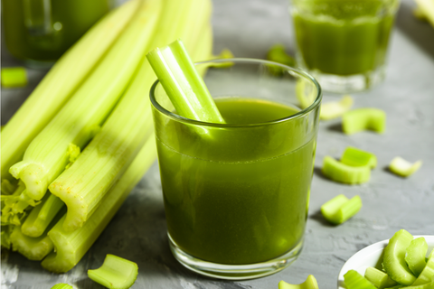 Celery juice and celery stalks