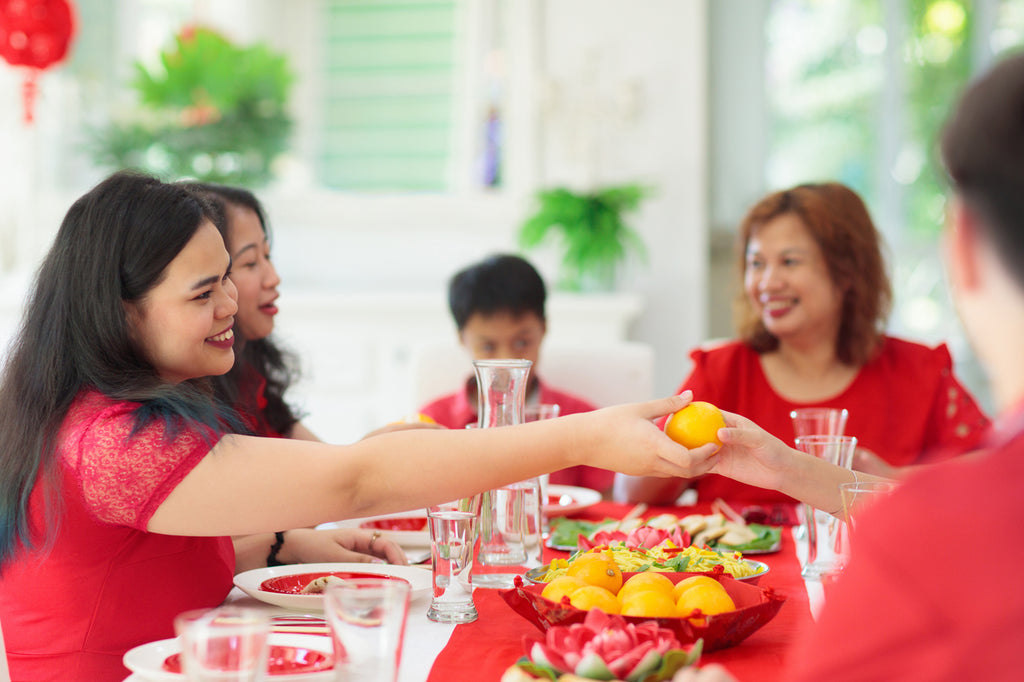 Giving oranges at Chinese New Year