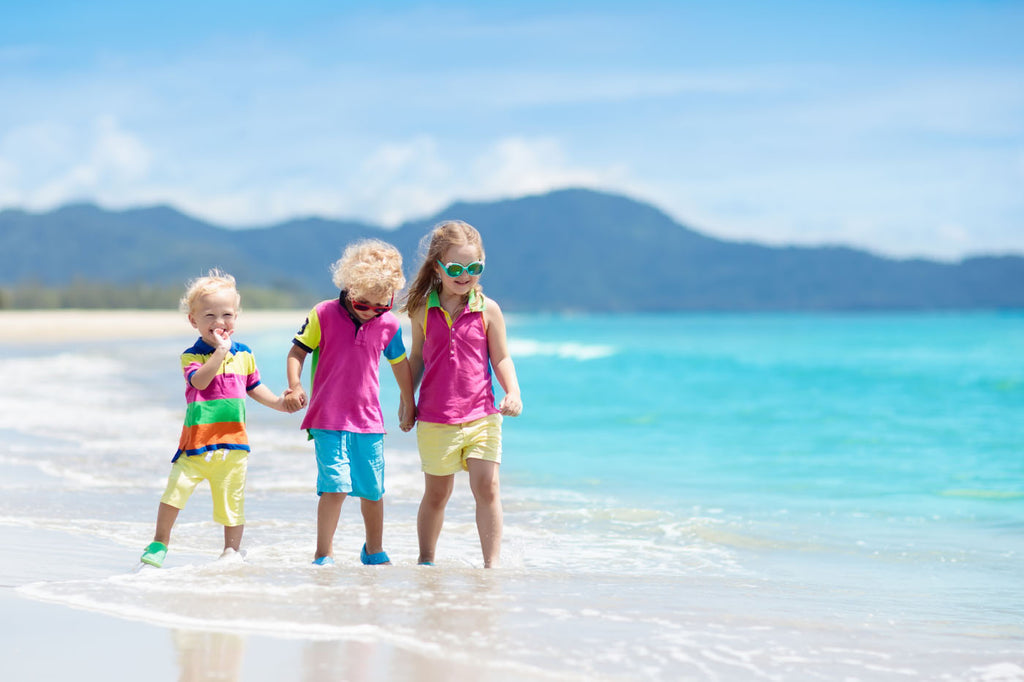 Kids in matching clothes on the beach