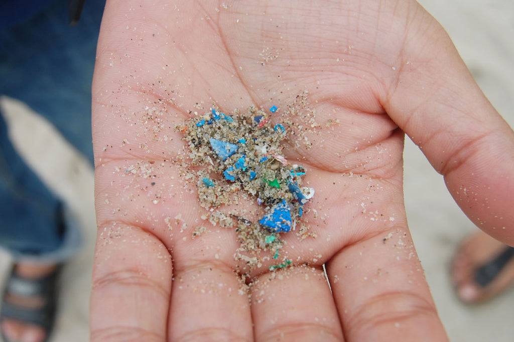 Micro plastic that found from beach lay on people hand.