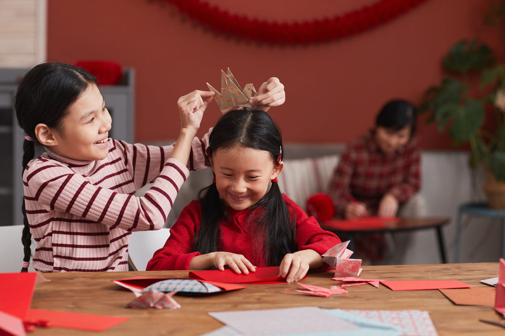 Sisters making Chinese New Year Crafts