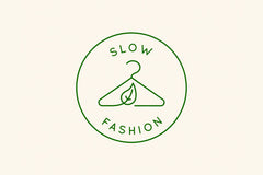A minimalist green 'Slow Fashion' badge with a sketched leaf and clothes hanger at the centre.