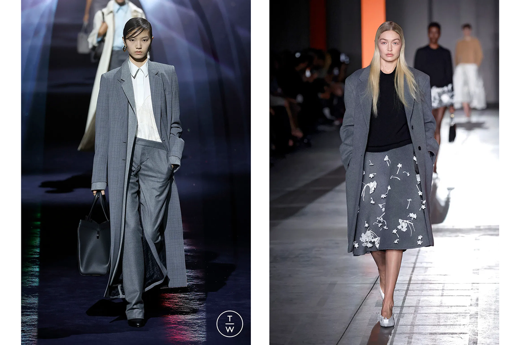 (Left) Grey Fendi pantsuit featuring a floor-length overcoat and white button-down. (Right) Grey Prada trench coat layered over a black scoop neck top and knee-length grey maxi skirt with white embellishments.