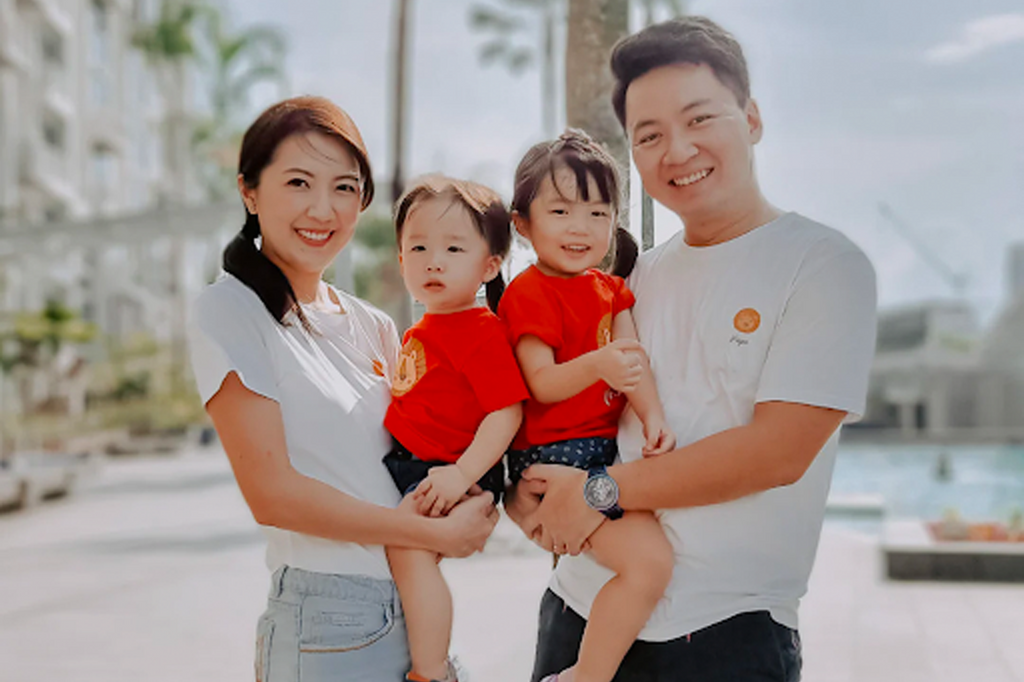 Family of four wears matching red and white t-shirts