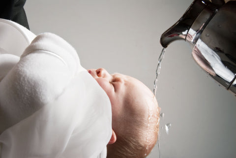 baby baptized in water