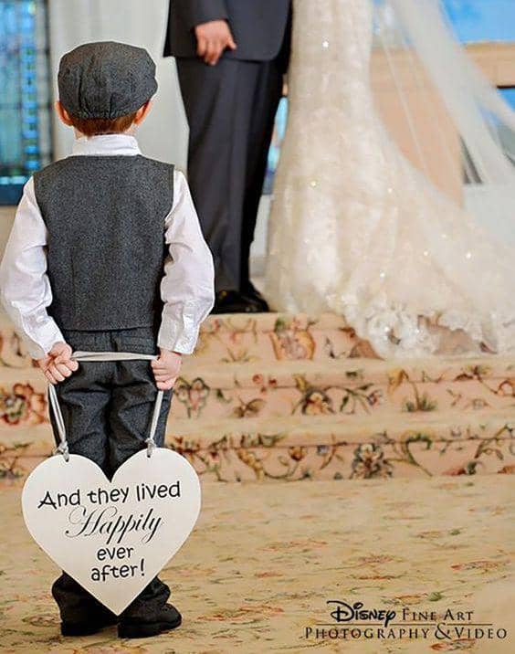 ring bearer with a sign