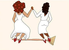 Brides dressed in white jumping the broom in marriage. 