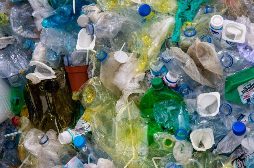 Close up photo of plastic bottles and other waste