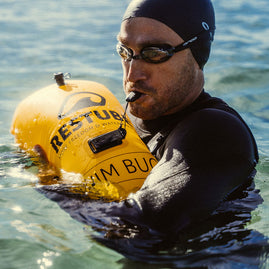 emergency whistle by RESTUBE used in the water with the swimming buoy by RESTUBE