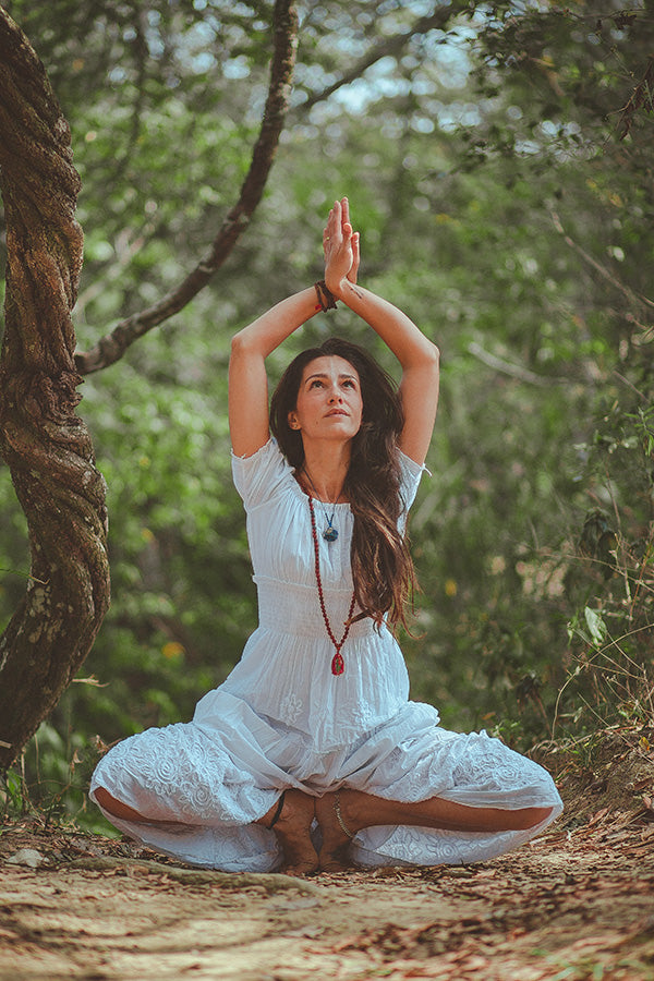 woman meditating for chakra alignment