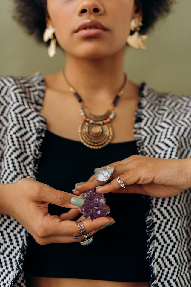 woman touching amethyst