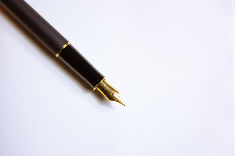 Close-up of a fountain pen on a notebook 