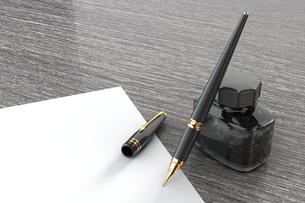 Fountain Pen with Ink Bottle on a wooden table